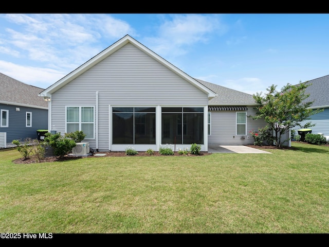 7024 Bonaventure St SW, Ocean Isle Beach, NC 28469 - back of house with a lawn, a patio area, cooling unit, a sunroom, and roof with shingles