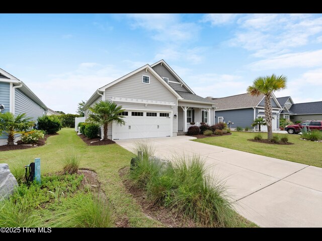 7024 Bonaventure St SW, Ocean Isle Beach, NC 28469 - view of front of property featuring a garage, a front yard, and driveway