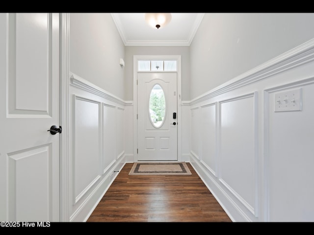 7024 Bonaventure St SW, Ocean Isle Beach, NC 28469 - doorway to outside with a decorative wall, a wainscoted wall, ornamental molding, and dark wood finished floors