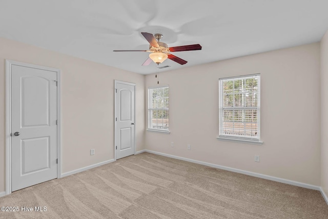 505 Oyster Rock Ln, Sneads Ferry, NC 28460 - unfurnished bedroom with light carpet, baseboards, and ceiling fan