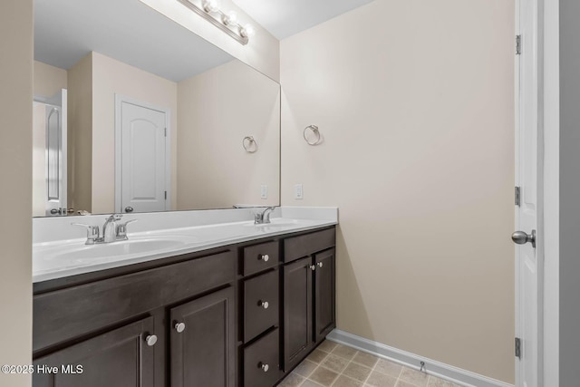 505 Oyster Rock Ln, Sneads Ferry, NC 28460 - bathroom with double vanity and baseboards