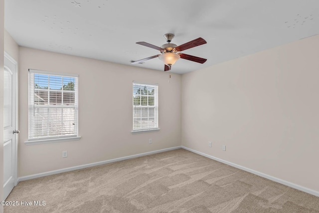 505 Oyster Rock Ln, Sneads Ferry, NC 28460 - carpeted empty room with plenty of natural light, baseboards, and ceiling fan