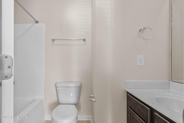 505 Oyster Rock Ln, Sneads Ferry, NC 28460 - bathroom with vanity, toilet, baseboards, and bathing tub / shower combination
