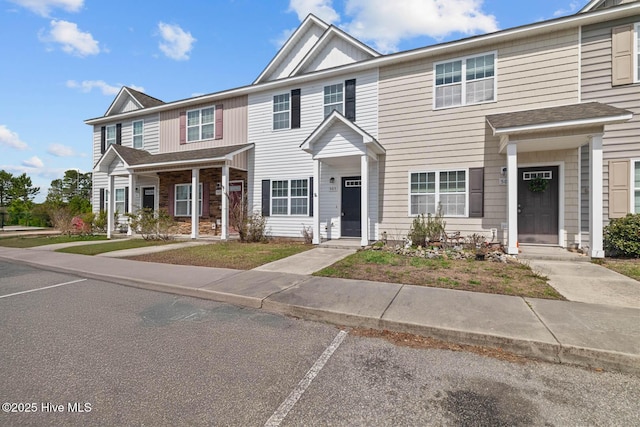 505 Oyster Rock Ln, Sneads Ferry, NC 28460 - multi unit property with board and batten siding and uncovered parking