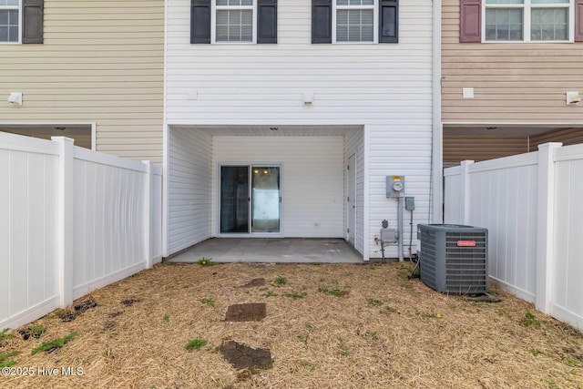 505 Oyster Rock Ln, Sneads Ferry, NC 28460 - back of house with cooling unit, a patio, and a fenced backyard