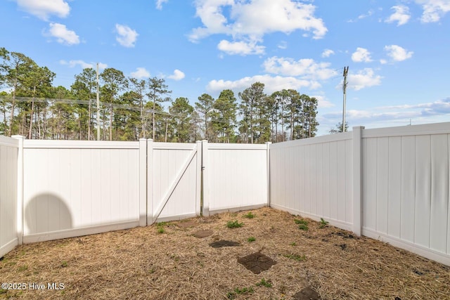 505 Oyster Rock Ln, Sneads Ferry, NC 28460 - fenced backyard with a gate