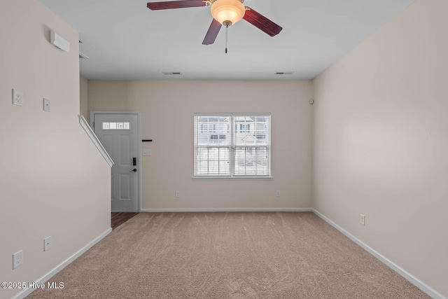 505 Oyster Rock Ln, Sneads Ferry, NC 28460 - unfurnished living room featuring carpet flooring, a ceiling fan, and baseboards