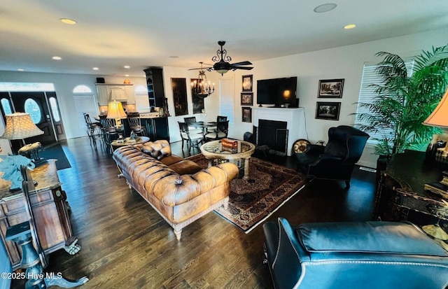 108 Kiawa Way, Atlantic Beach, NC 28512 - living area with dark wood-style flooring, a chandelier, recessed lighting, and a fireplace