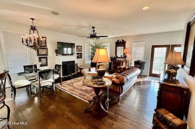 108 Kiawa Way, Atlantic Beach, NC 28512 - living area with a fireplace with flush hearth, dark wood-style floors, a chandelier, recessed lighting, and a ceiling fan