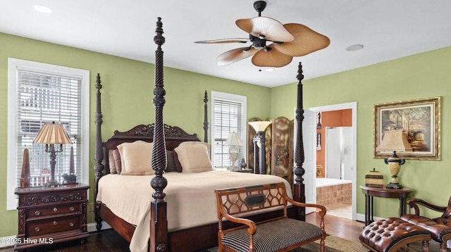 108 Kiawa Way, Atlantic Beach, NC 28512 - bedroom with wood finished floors, baseboards, and connected bathroom