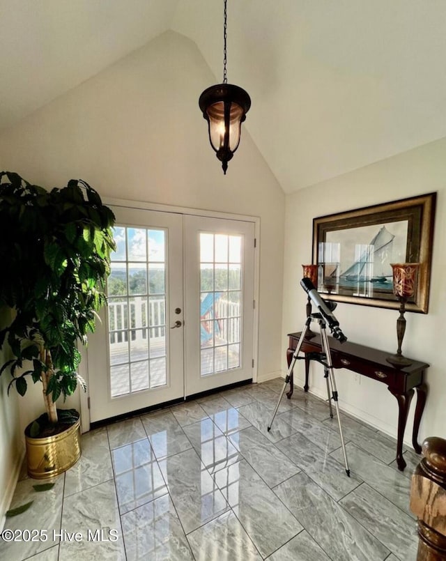 108 Kiawa Way, Atlantic Beach, NC 28512 - entryway featuring marble look tile flooring, french doors, high vaulted ceiling, and baseboards