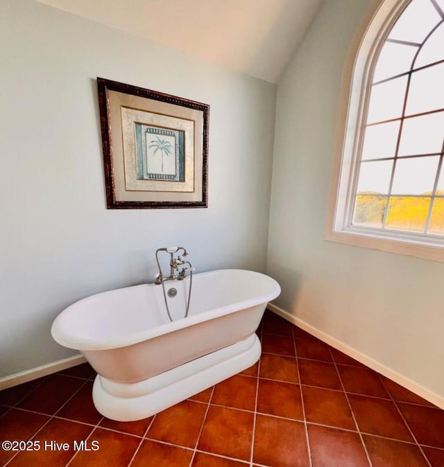 108 Kiawa Way, Atlantic Beach, NC 28512 - full bathroom with a freestanding tub, tile patterned flooring, baseboards, and vaulted ceiling