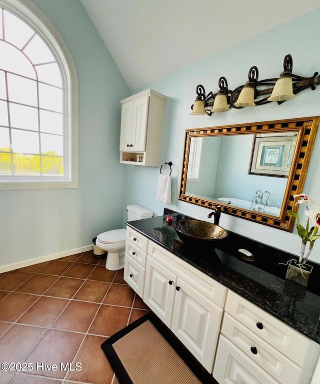 108 Kiawa Way, Atlantic Beach, NC 28512 - full bathroom featuring lofted ceiling, vanity, toilet, tile patterned floors, and a bathtub