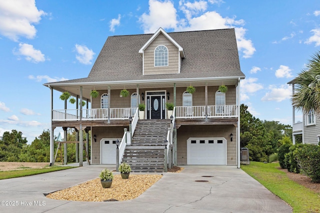108 Kiawa Way, Atlantic Beach, NC 28512 - coastal inspired home with an attached garage, covered porch, and concrete driveway