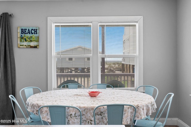 926 E Beach Dr, Oak Island, NC 28465 - dining room featuring baseboards
