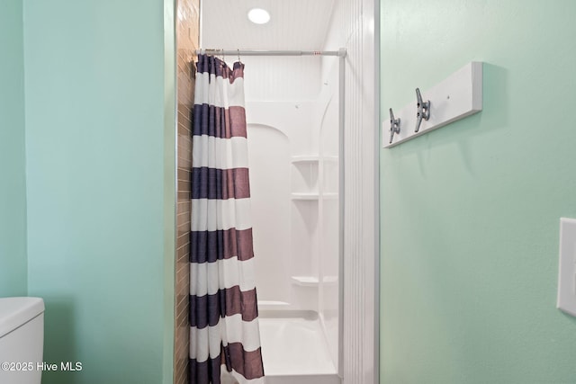 926 E Beach Dr, Oak Island, NC 28465 - bathroom featuring a shower with curtain and toilet