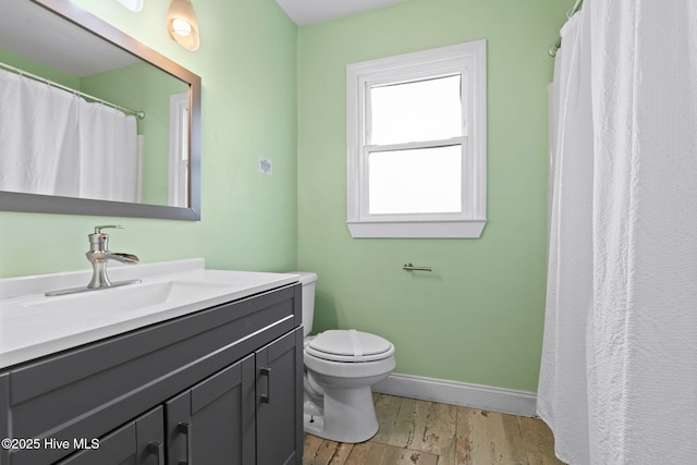 926 E Beach Dr, Oak Island, NC 28465 - full bath with vanity, toilet, baseboards, and a shower with curtain