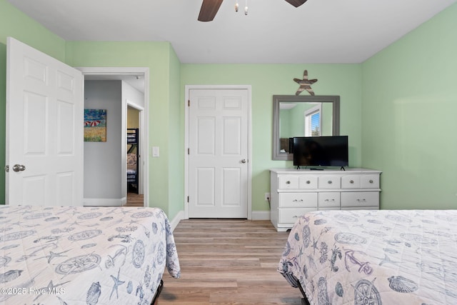 926 E Beach Dr, Oak Island, NC 28465 - bedroom with light wood-style flooring, baseboards, and ceiling fan