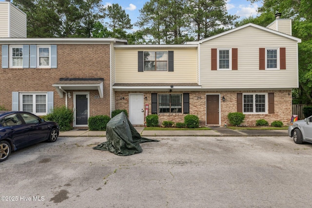 24 Donnell, Havelock, NC 28532 - view of property featuring brick siding and a chimney