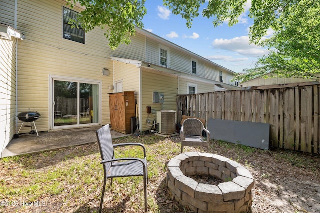 24 Donnell, Havelock, NC 28532 - rear view of house with central air condition unit, a fire pit, and a patio area