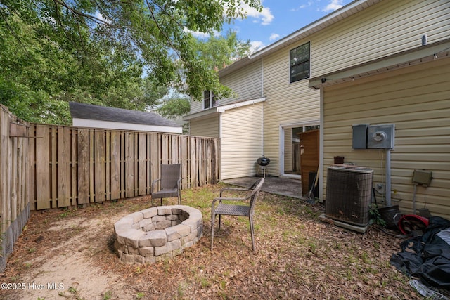 24 Donnell, Havelock, NC 28532 - view of yard featuring central AC unit, a fire pit, and a patio