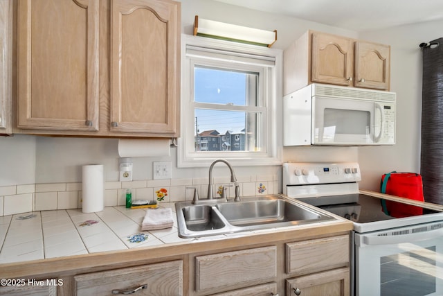3045 Island Dr, North Topsail Beach, NC 28460 - kitchen featuring white appliances, tile counters, light brown cabinetry, a sink, and tile patterned flooring