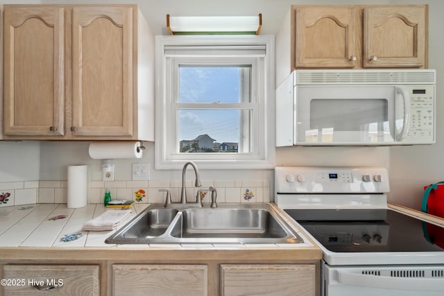 3045 Island Dr, North Topsail Beach, NC 28460 - kitchen featuring white appliances, a sink, light brown cabinets, and tile countertops