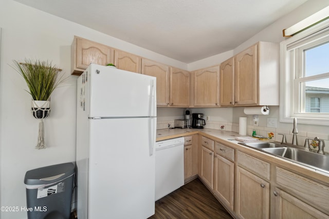 3045 Island Dr, North Topsail Beach, NC 28460 - kitchen with white appliances, light brown cabinets, a sink, light countertops, and dark wood finished floors