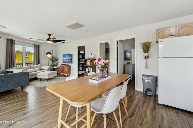 3045 Island Dr, North Topsail Beach, NC 28460 - dining area with wood finished floors and a ceiling fan