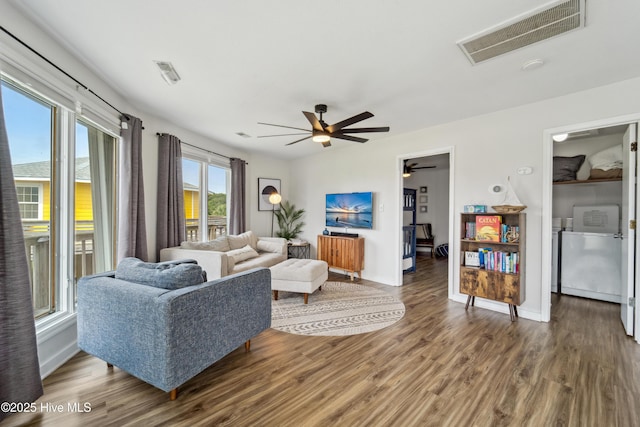 3045 Island Dr, North Topsail Beach, NC 28460 - living area featuring wood finished floors, ceiling fan, and baseboards