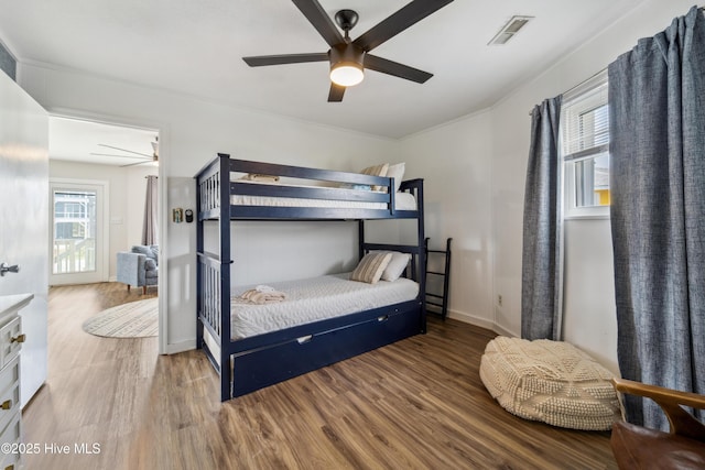 3045 Island Dr, North Topsail Beach, NC 28460 - bedroom featuring wood finished floors and a ceiling fan