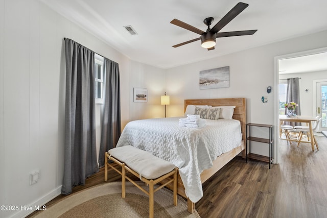 3045 Island Dr, North Topsail Beach, NC 28460 - bedroom featuring wood finished floors, baseboards, and a ceiling fan