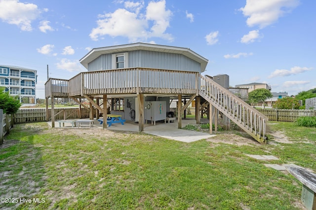 3045 Island Dr, North Topsail Beach, NC 28460 - back of house featuring stairway, a wooden deck, and a patio area