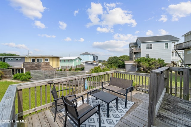 3045 Island Dr, North Topsail Beach, NC 28460 - wooden terrace featuring a residential view and a yard