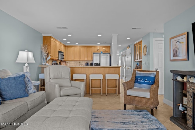 331 Salter Path Rd Unit 211, Pine Knoll Shores, NC 28512 - living room featuring light tile patterned floors, recessed lighting, and baseboards
