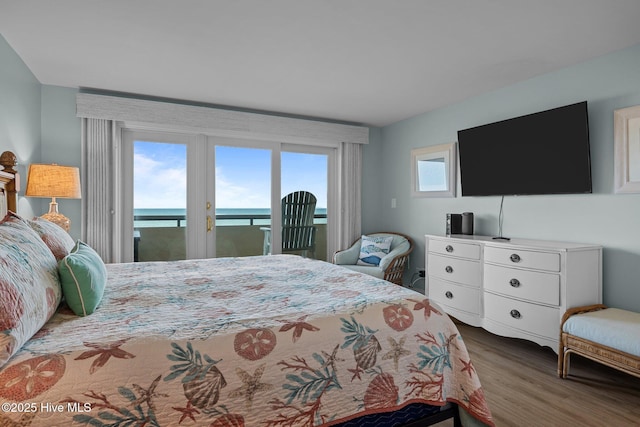 331 Salter Path Rd Unit 211, Pine Knoll Shores, NC 28512 - bedroom with access to outside and wood finished floors