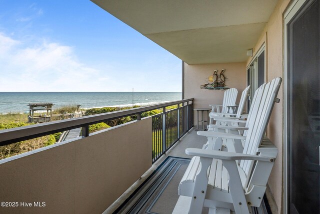 331 Salter Path Rd Unit 211, Pine Knoll Shores, NC 28512 - balcony featuring view of water and beach