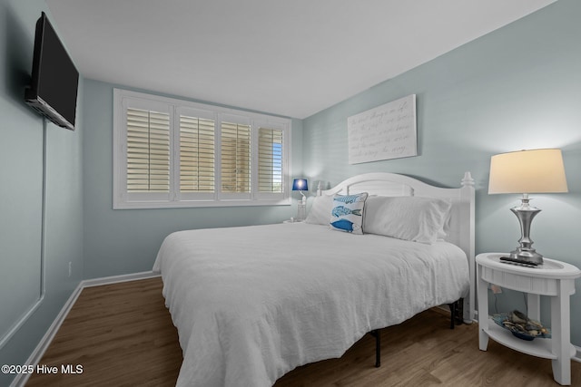331 Salter Path Rd Unit 211, Pine Knoll Shores, NC 28512 - bedroom with wood finished floors and baseboards