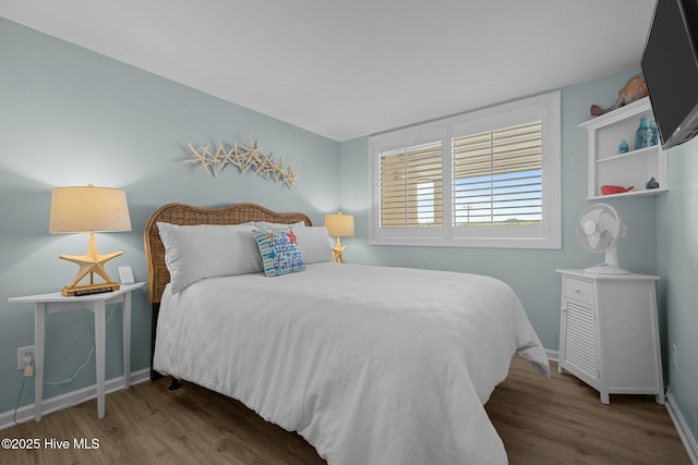 331 Salter Path Rd Unit 211, Pine Knoll Shores, NC 28512 - bedroom with wood finished floors and baseboards