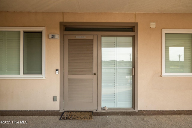 331 Salter Path Rd Unit 211, Pine Knoll Shores, NC 28512 - doorway to property featuring stucco siding