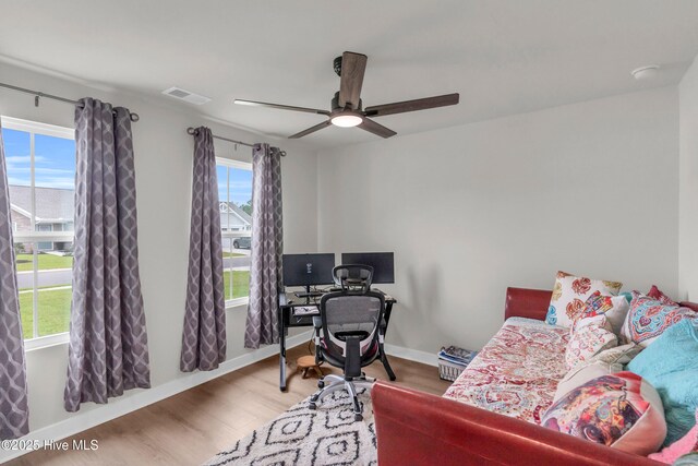 818 Ashlar Cir, Navassa, NC 28451 - bedroom featuring wood finished floors, baseboards, a ceiling fan, and an office area