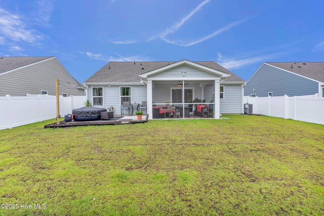 818 Ashlar Cir, Navassa, NC 28451 - back of house with a ceiling fan, a hot tub, a sunroom, and roof with shingles