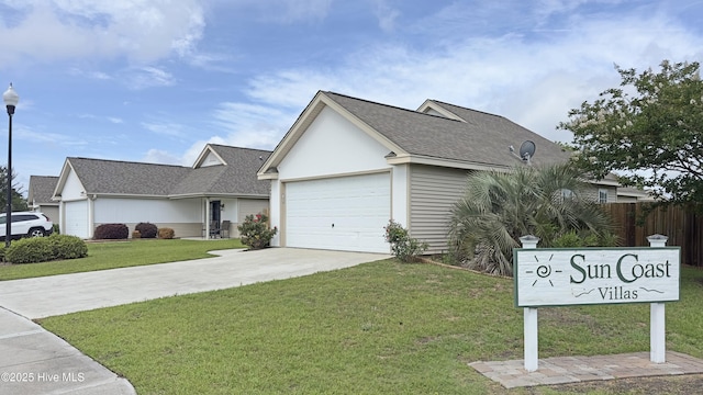 2409 White Rd, Wilmington, NC 28411 - view of front of home with driveway, a shingled roof, and an attached garage