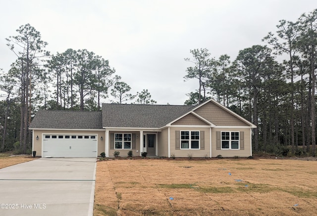 941 Downing Rd, Southport, NC 28461 - view of front of house featuring driveway, an attached garage, a front yard, and roof with shingles