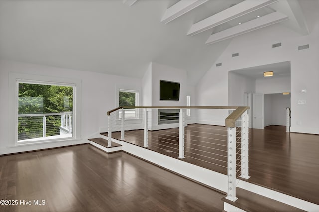 1064 Ocean Ridge Dr, Wilmington, NC 28405 - unfurnished room featuring beamed ceiling, wood finished floors, and high vaulted ceiling