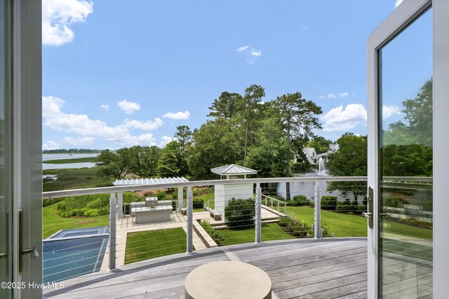 1064 Ocean Ridge Dr, Wilmington, NC 28405 - deck with a water view and a lawn