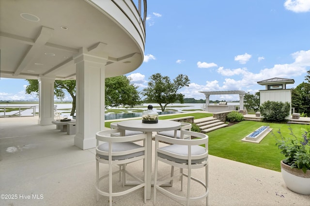 1064 Ocean Ridge Dr, Wilmington, NC 28405 - view of patio with outdoor dining space and a water view