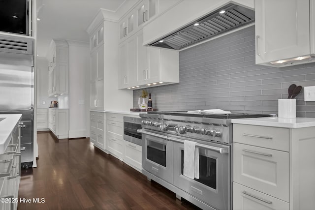 1064 Ocean Ridge Dr, Wilmington, NC 28405 - kitchen featuring double oven range, custom range hood, decorative backsplash, light countertops, and white cabinets