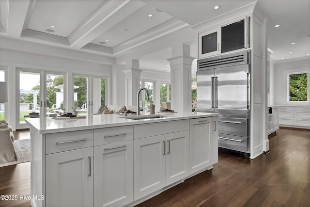 1064 Ocean Ridge Dr, Wilmington, NC 28405 - kitchen featuring stainless steel built in fridge, a sink, dark wood finished floors, white cabinets, and ornamental molding