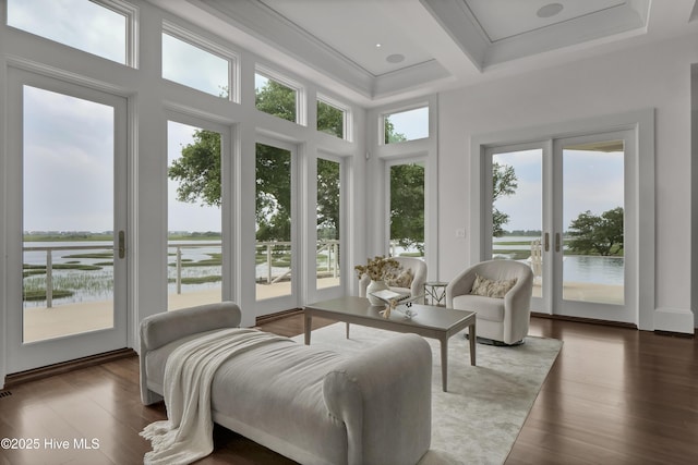 1064 Ocean Ridge Dr, Wilmington, NC 28405 - sunroom / solarium featuring beamed ceiling, coffered ceiling, wood finished floors, a water view, and a high ceiling